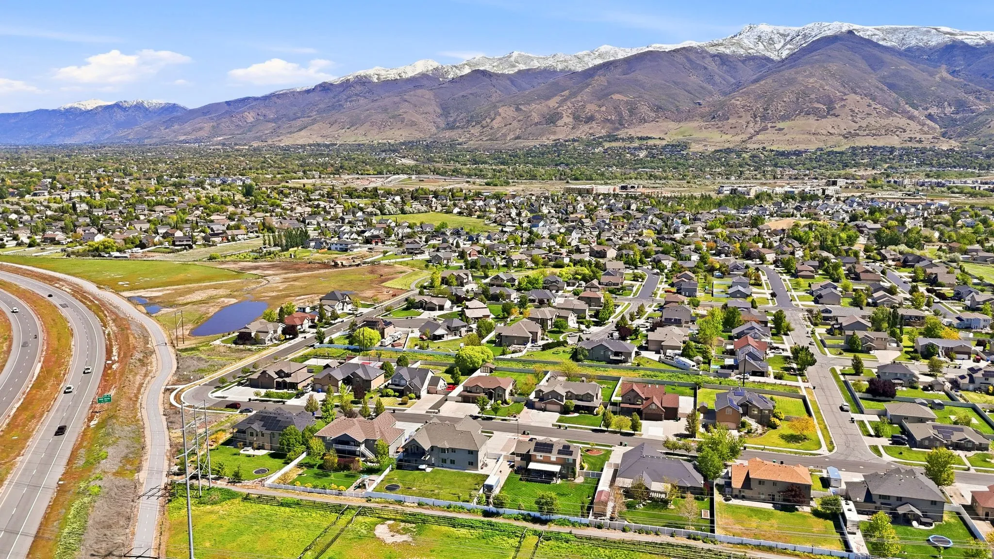 Aerial view of residential area featuring mountains