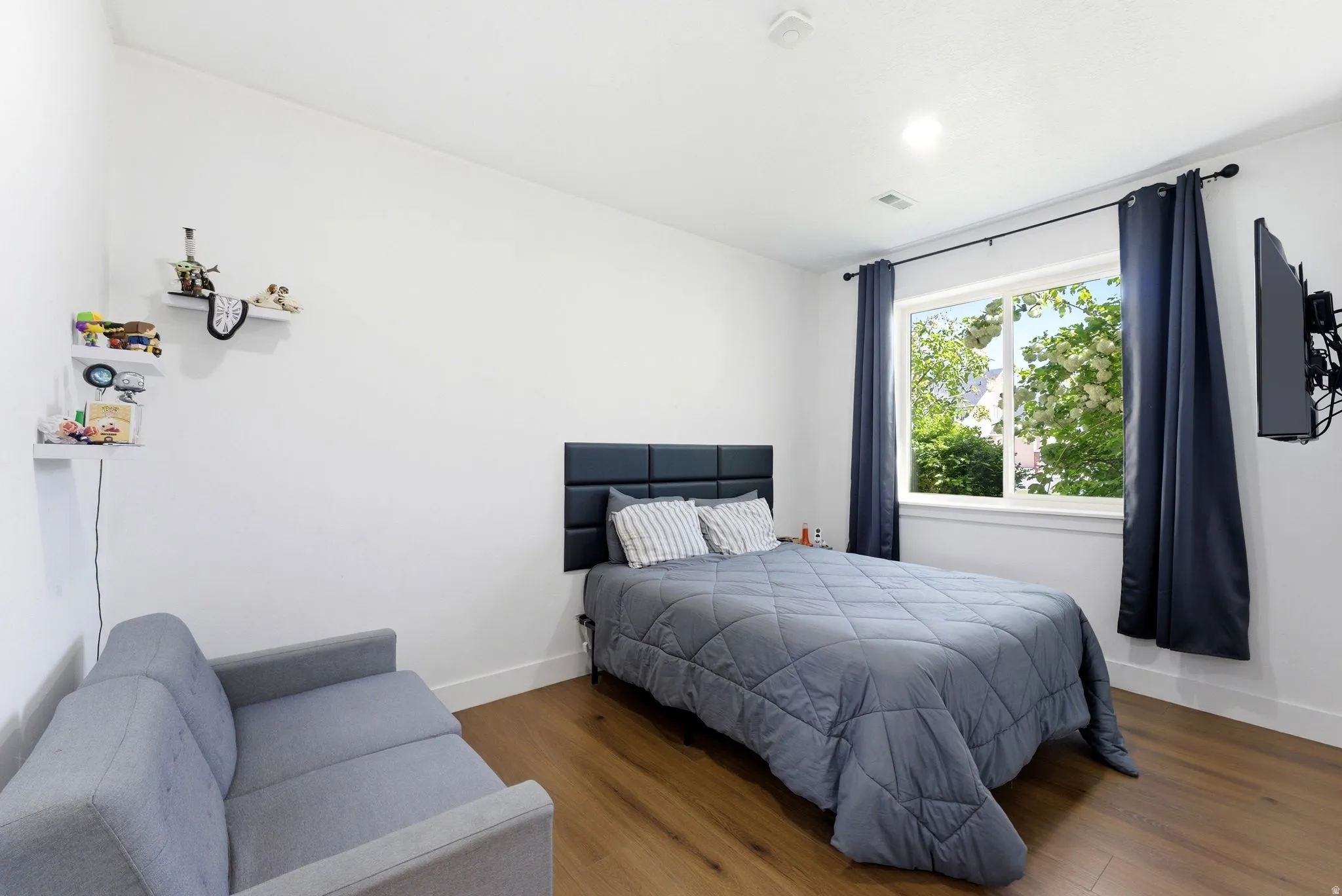 Bedroom with wood finished floors