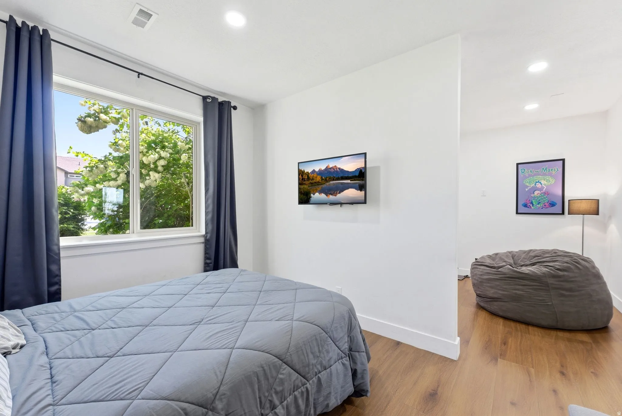 Bedroom featuring wood finished floors and recessed lighting