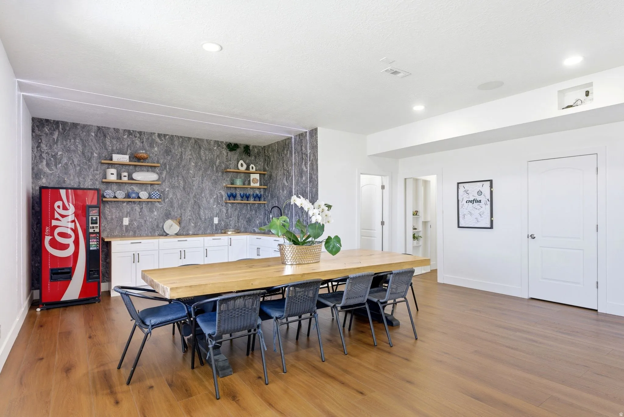 Dining area featuring light wood finished floors and recessed lighting