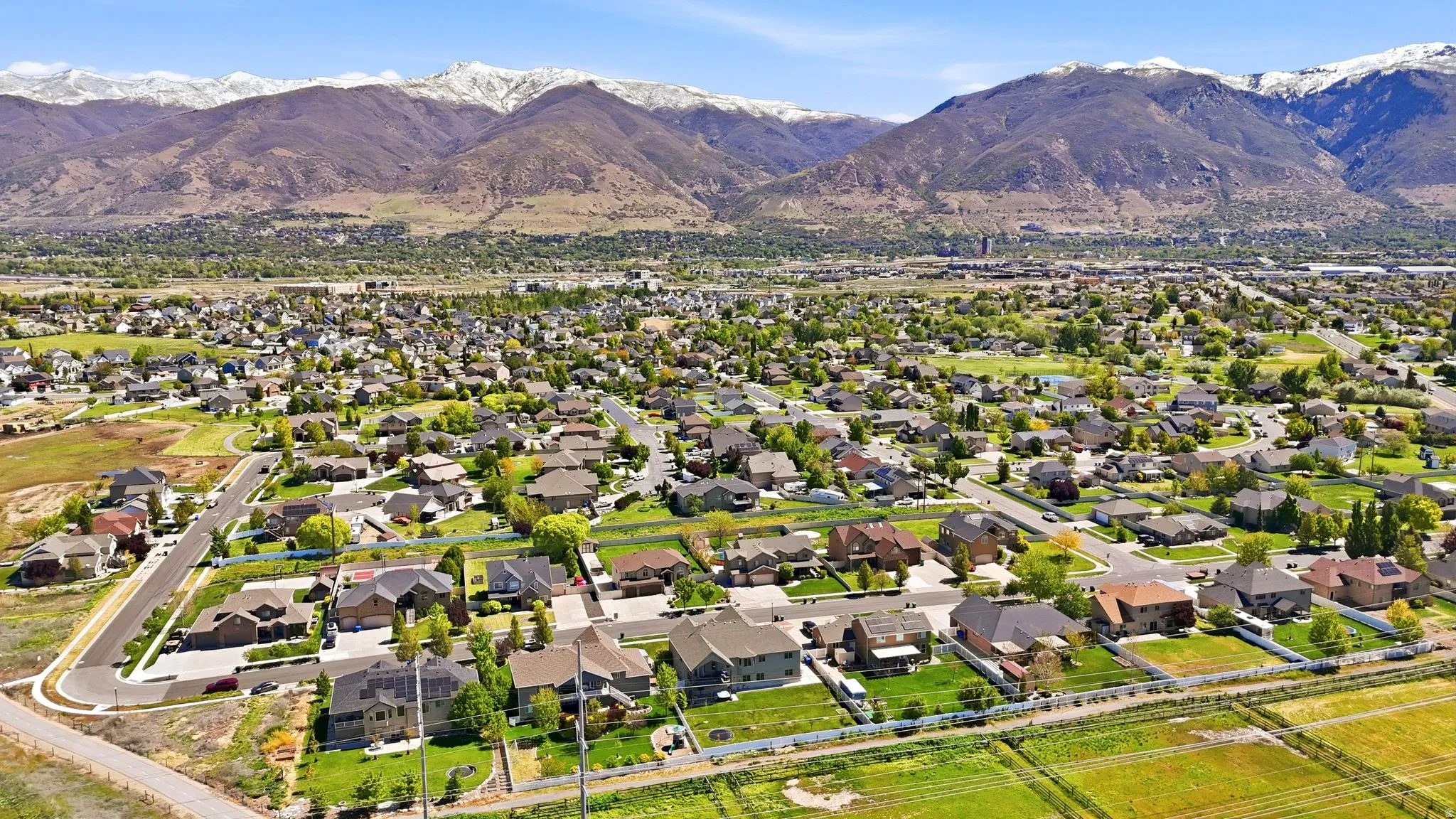 Aerial view of residential area featuring a mountainous background
