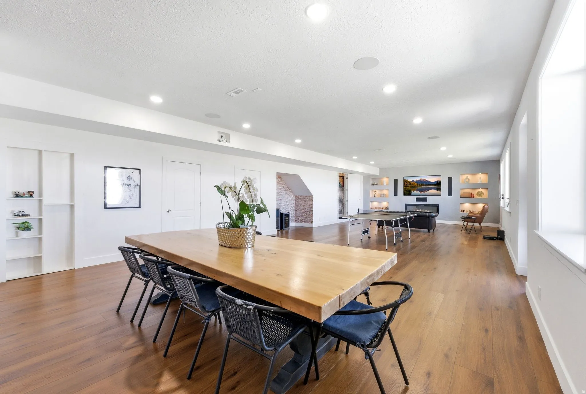Dining space with dark wood-style flooring and recessed lighting