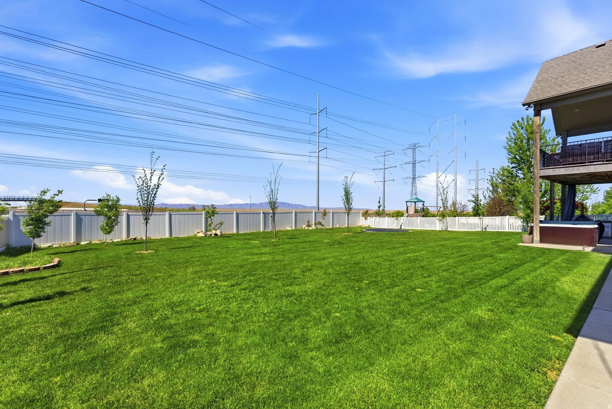 View of fenced backyard