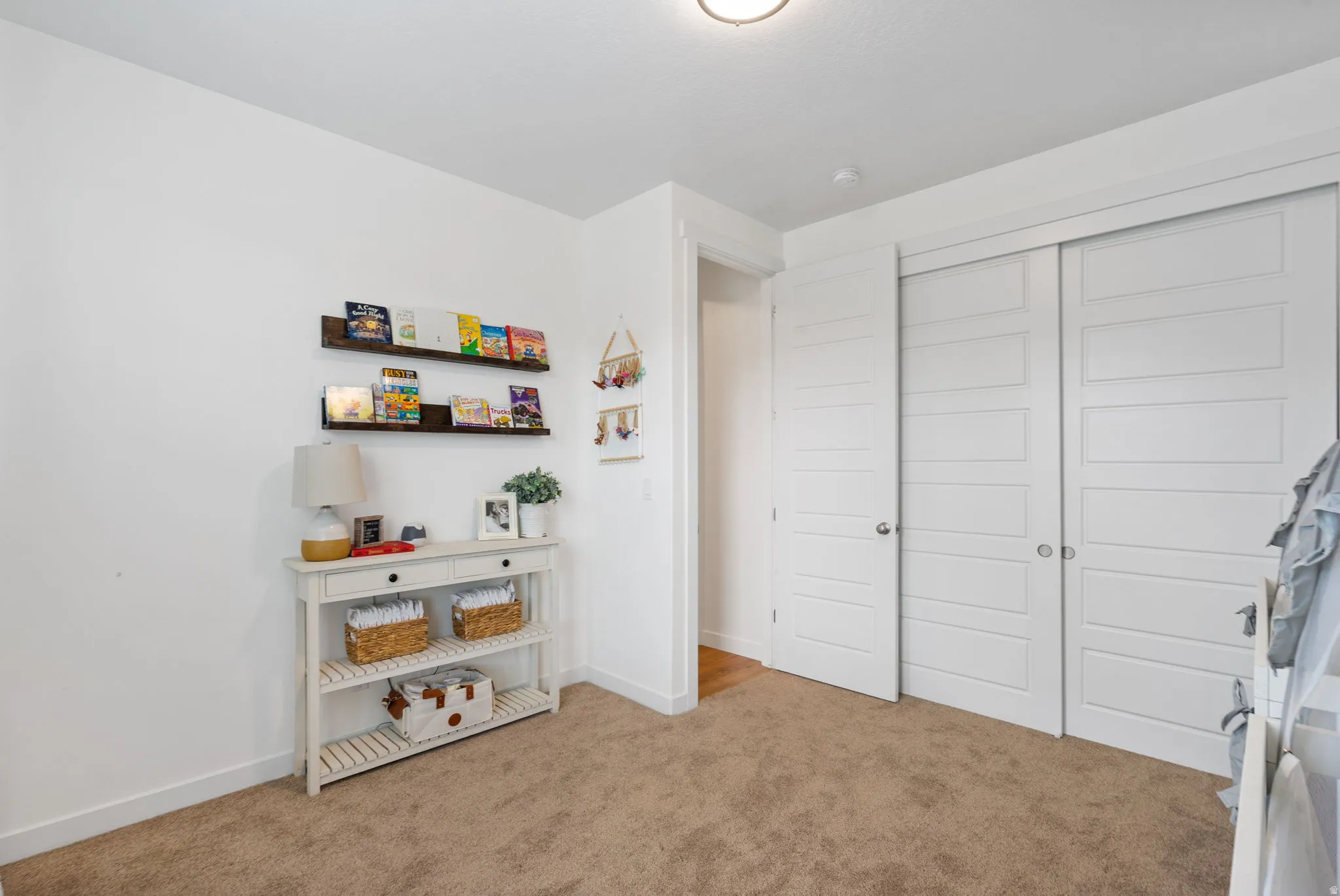 Plush carpeting throughout with white baseboards