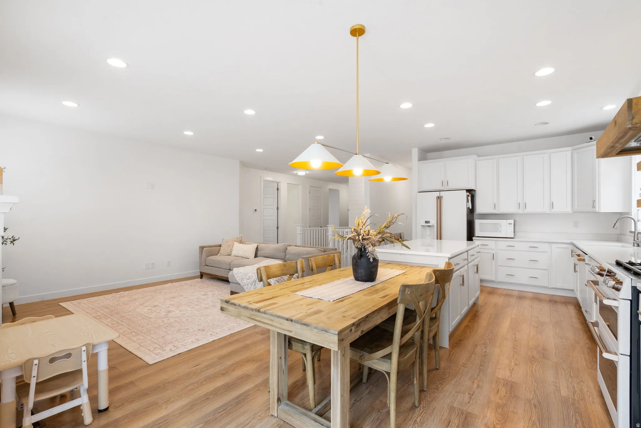 Open-concept living area with wood-finish flooring