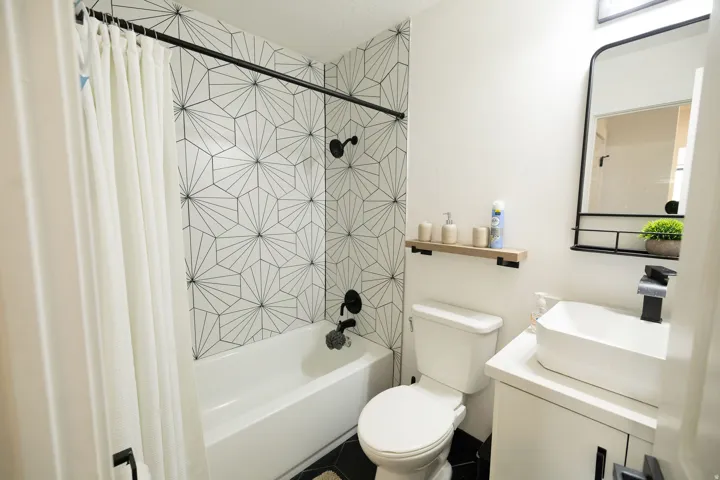 Full bathroom featuring vanity and shower / bath combo with shower curtain