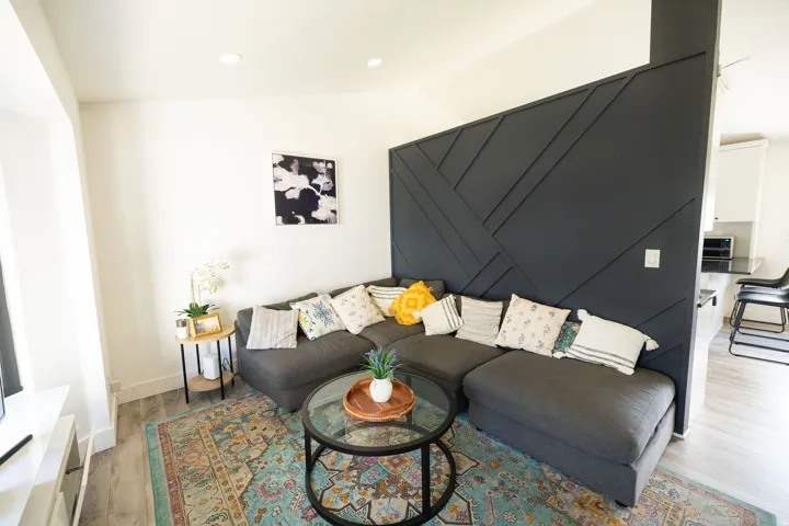 Living area with wood finished floors and recessed lighting