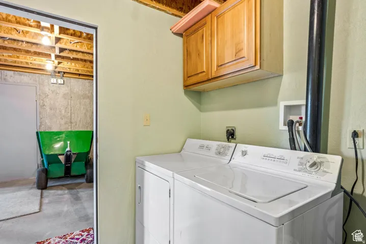Dedicated laundry area featuring a washer and dryer
