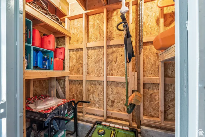 Utility shed with plywood walls and exposed wooden framing
