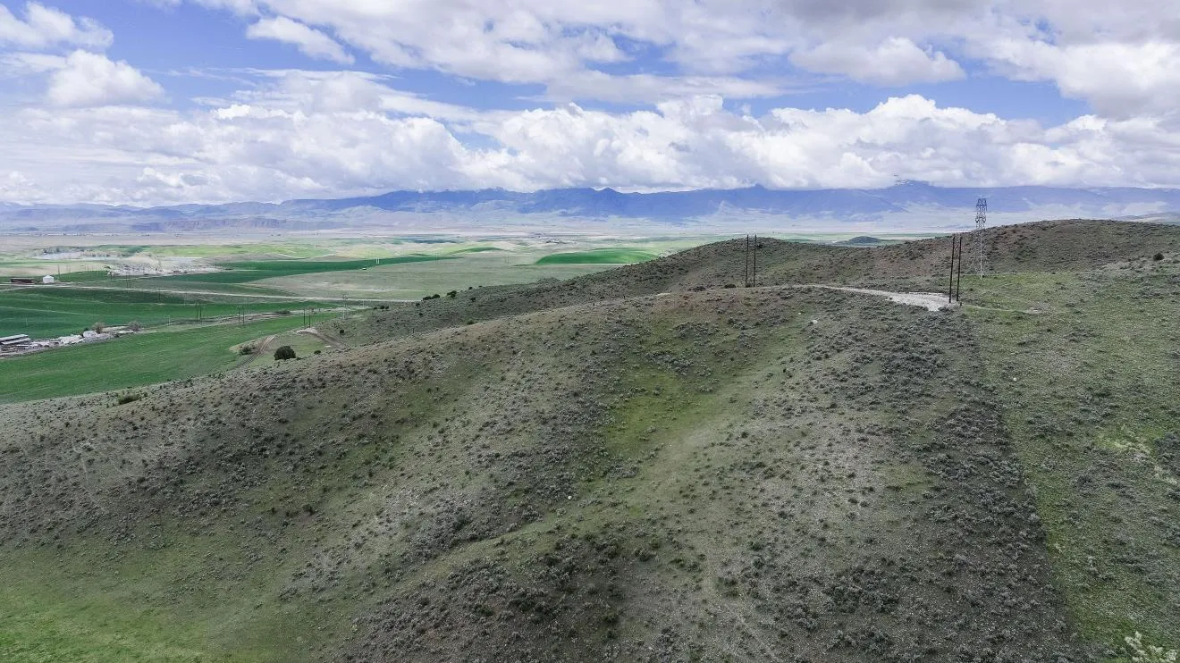 Expansive rolling hills with natural vegetation