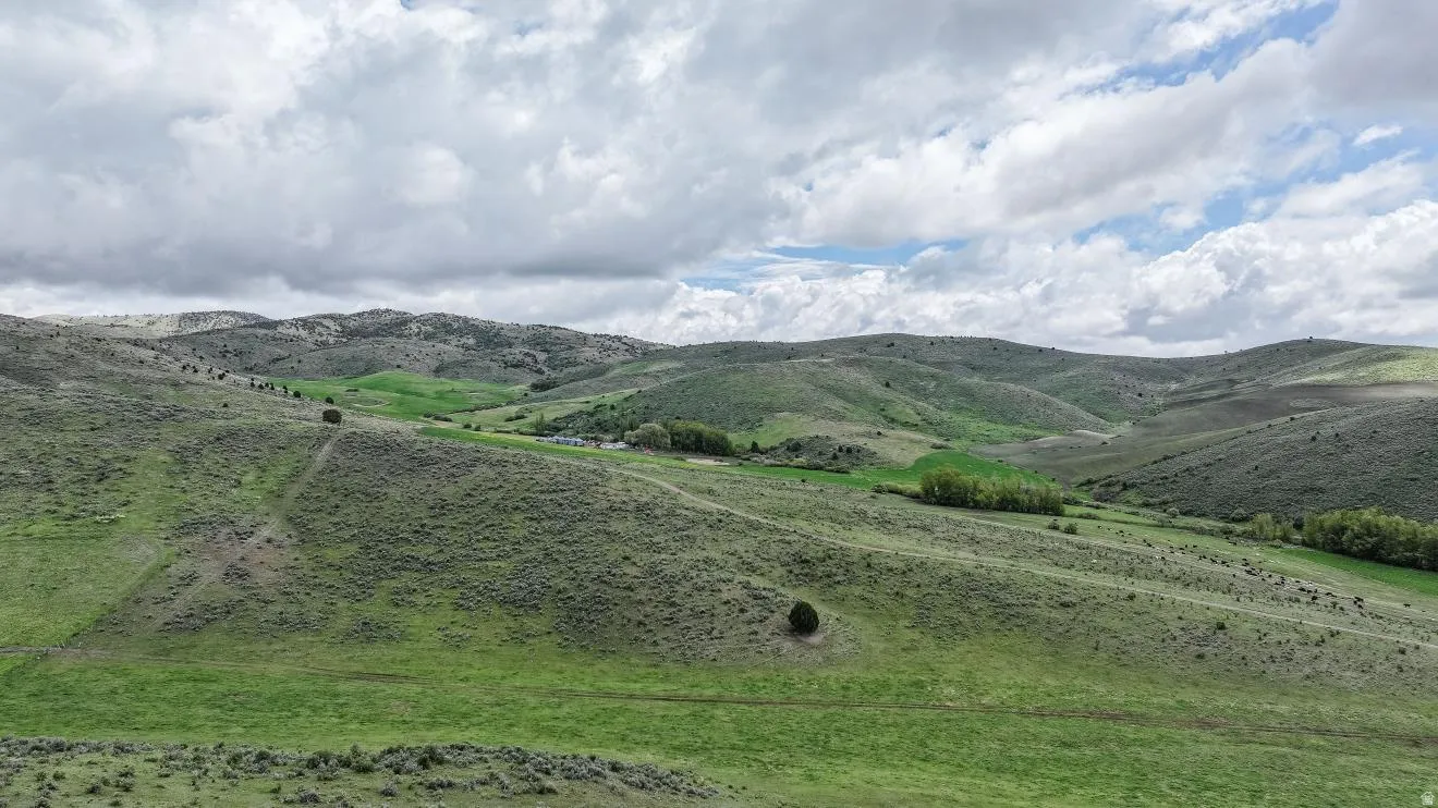 Expansive rolling hills featuring natural green and sagebrush ground cover