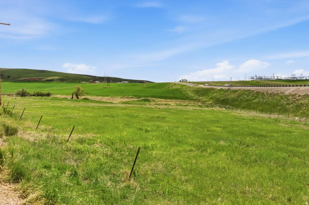Expansive green space featuring rolling hills and open fields