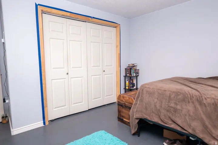 Bi-fold closet doors with white paneling and brushed nickel hardware