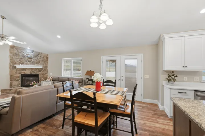 Living and dining areas featuring wood-finish flooring