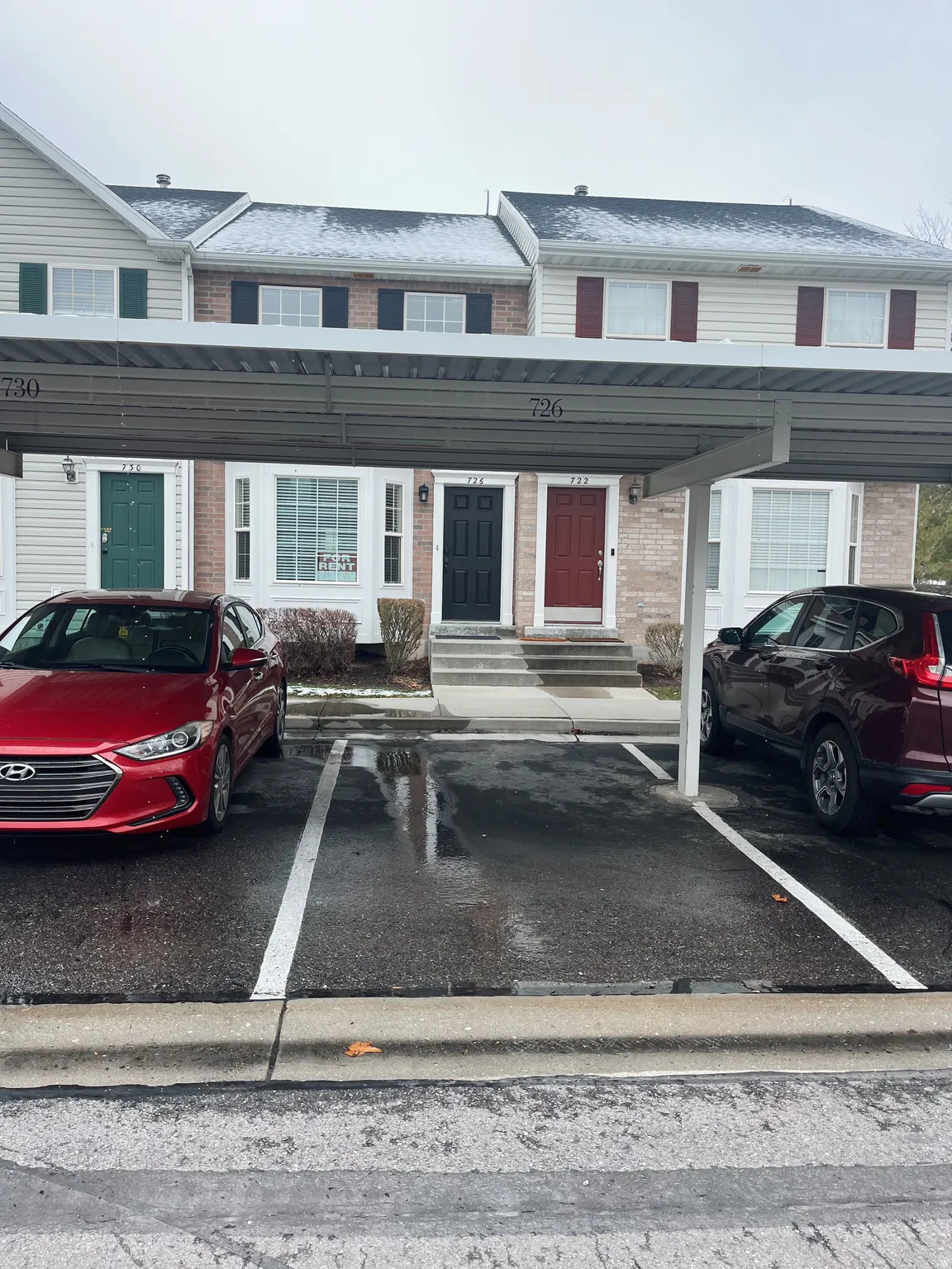Covered carport parking with two designated spaces