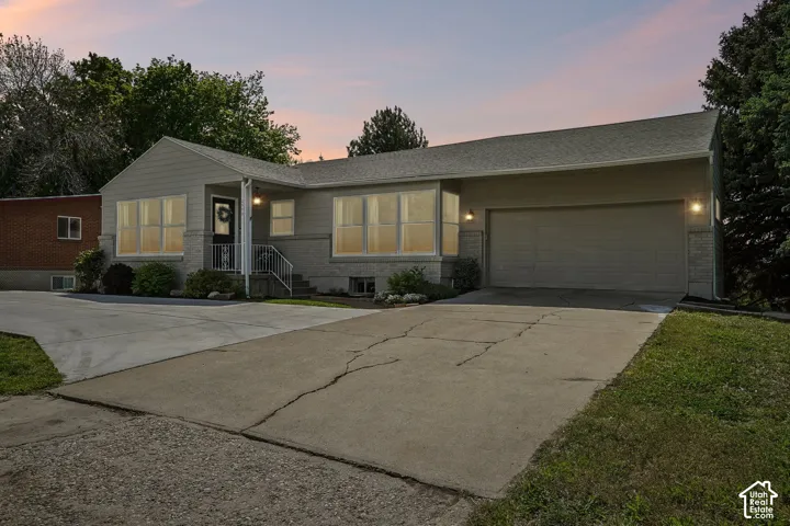 Two-car attached garage with concrete driveway