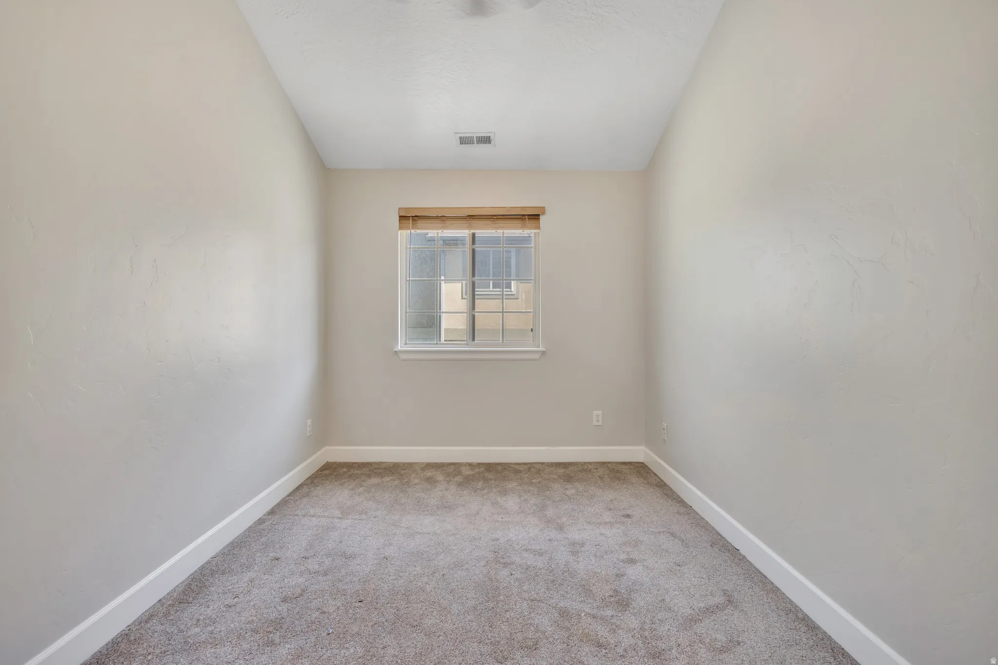Neutral-toned interior with light gray walls and white baseboards