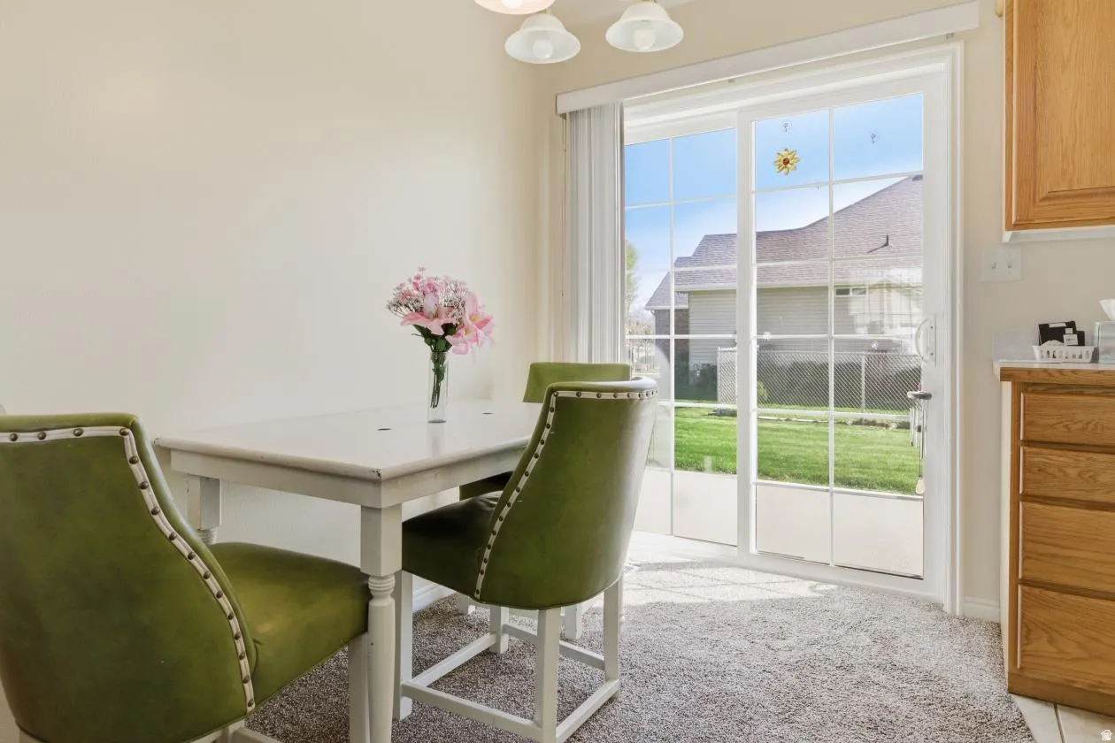Sliding glass patio door with grid pattern and vertical blinds
