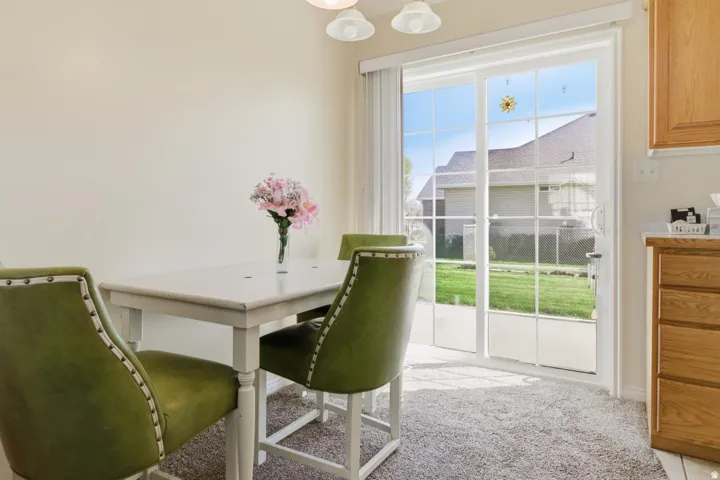 Sliding glass patio door with grid pattern and vertical blinds