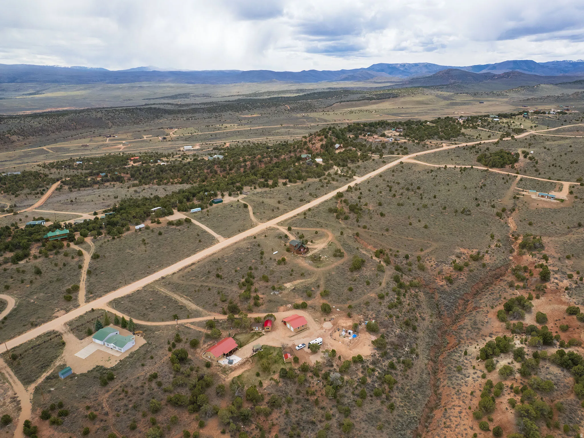 Aerial view of sparsely populated area with a mountain backdrop