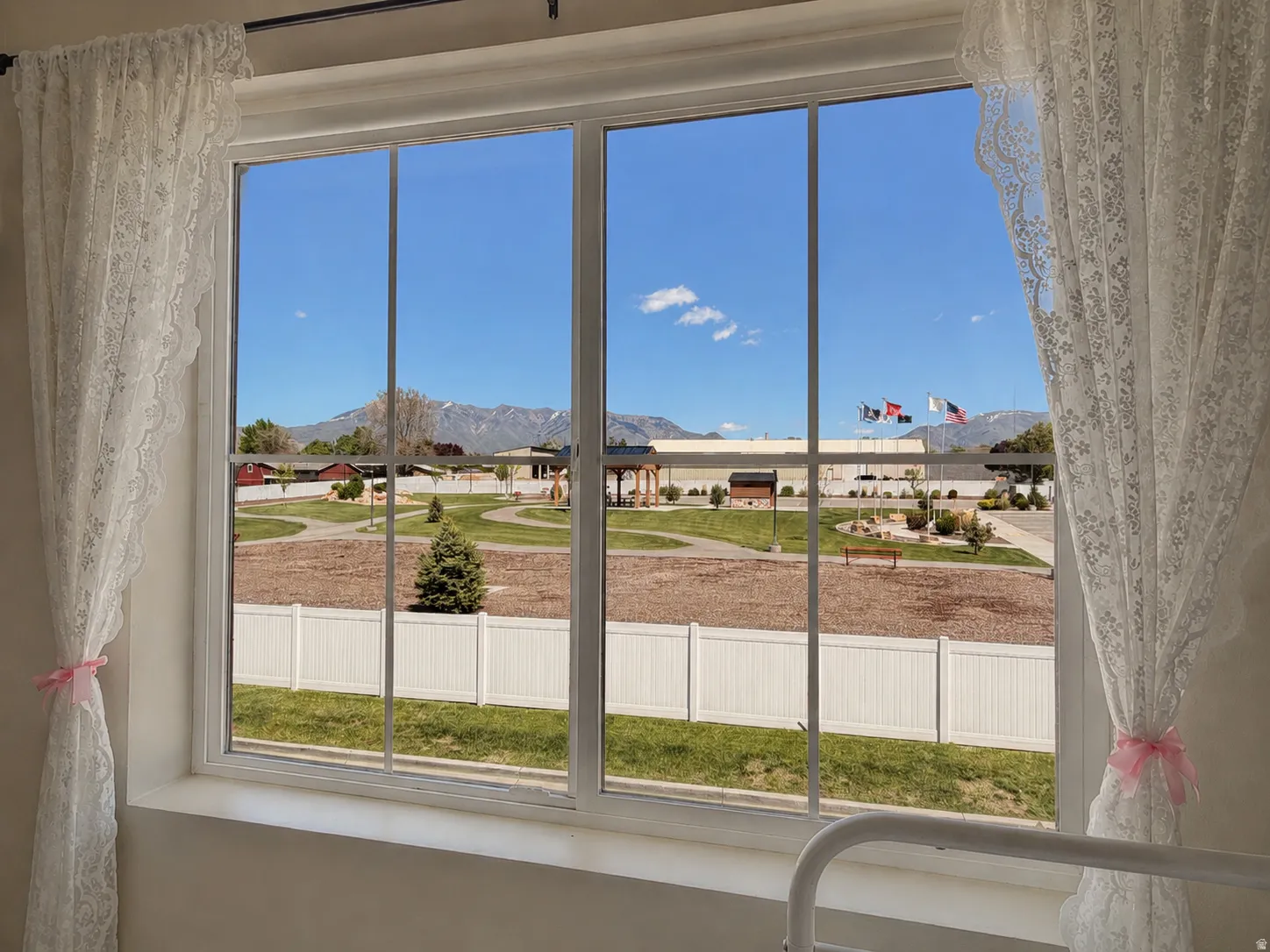 Large multi-pane window framing distant mountains