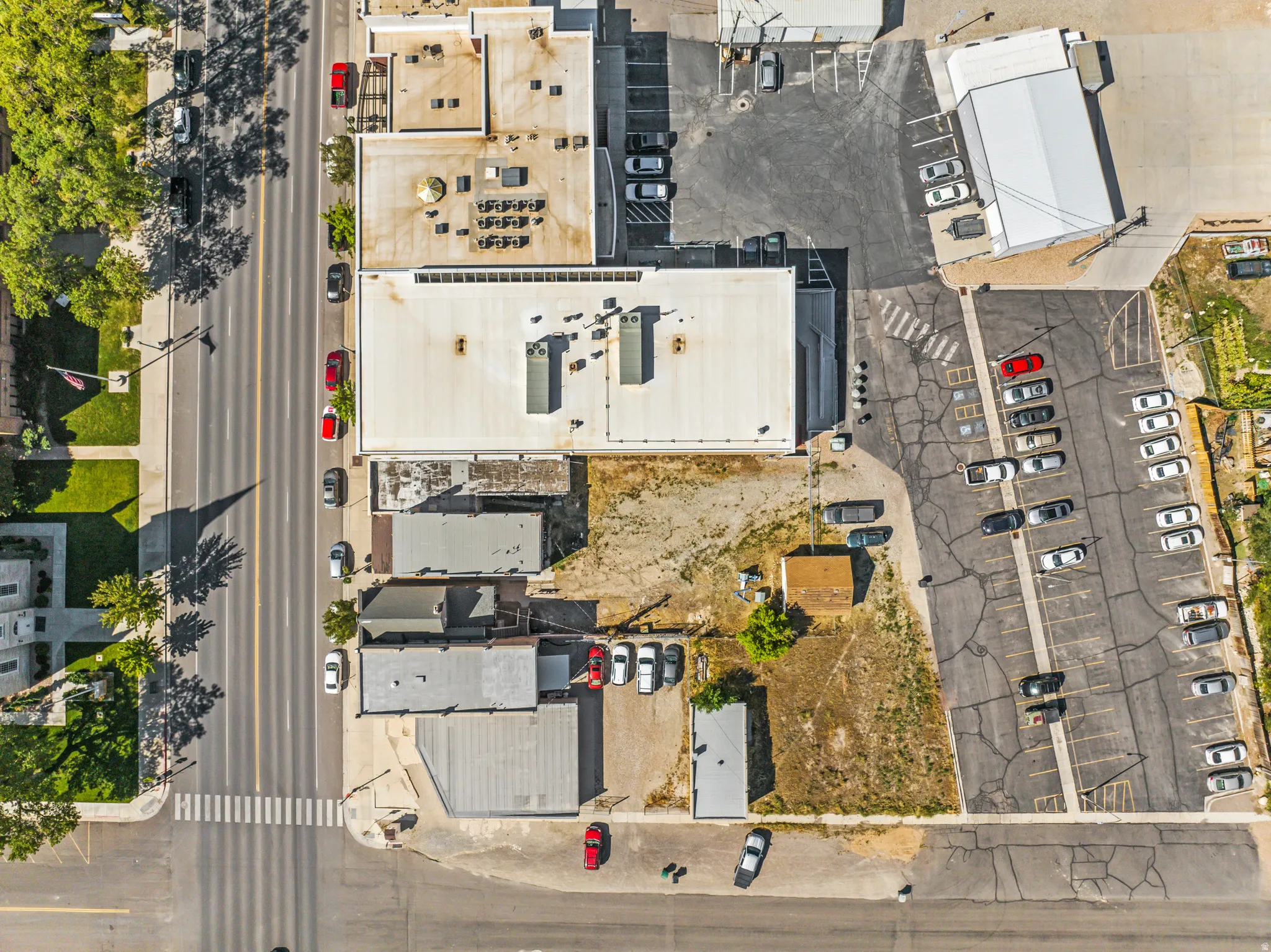 Aerial view of a commercial area featuring multiple buildings with flat roofs
