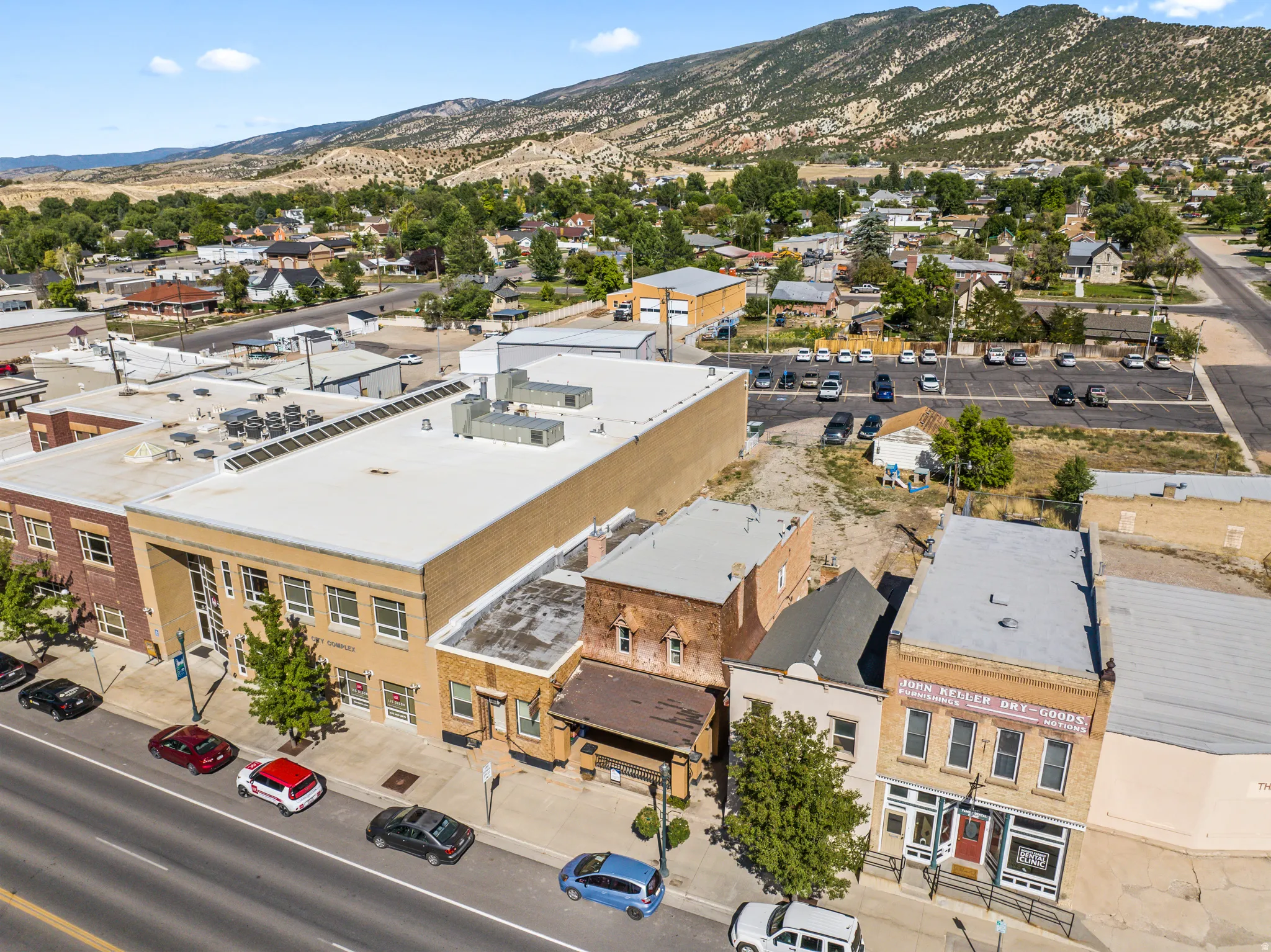 Commercial properties featuring brick and stucco facades, multiple storefronts, and ample street-side parking