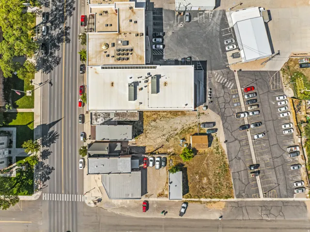 Aerial view of a commercial area featuring multiple buildings with flat roofs