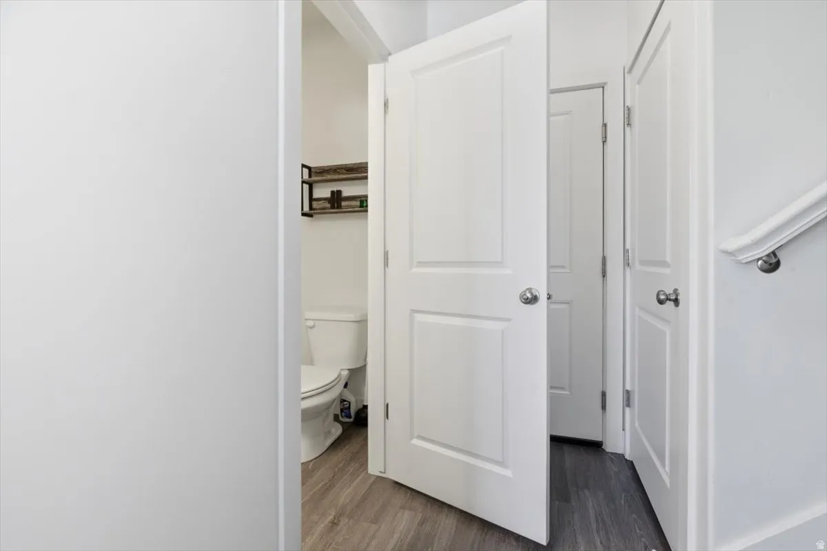 Interior doorway opening to a partial bathroom view with a white toilet