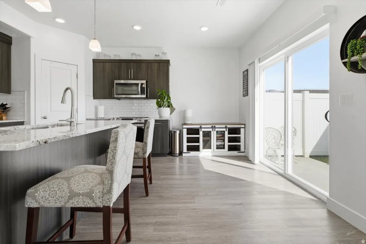 Kitchen open to the fenced in back yard