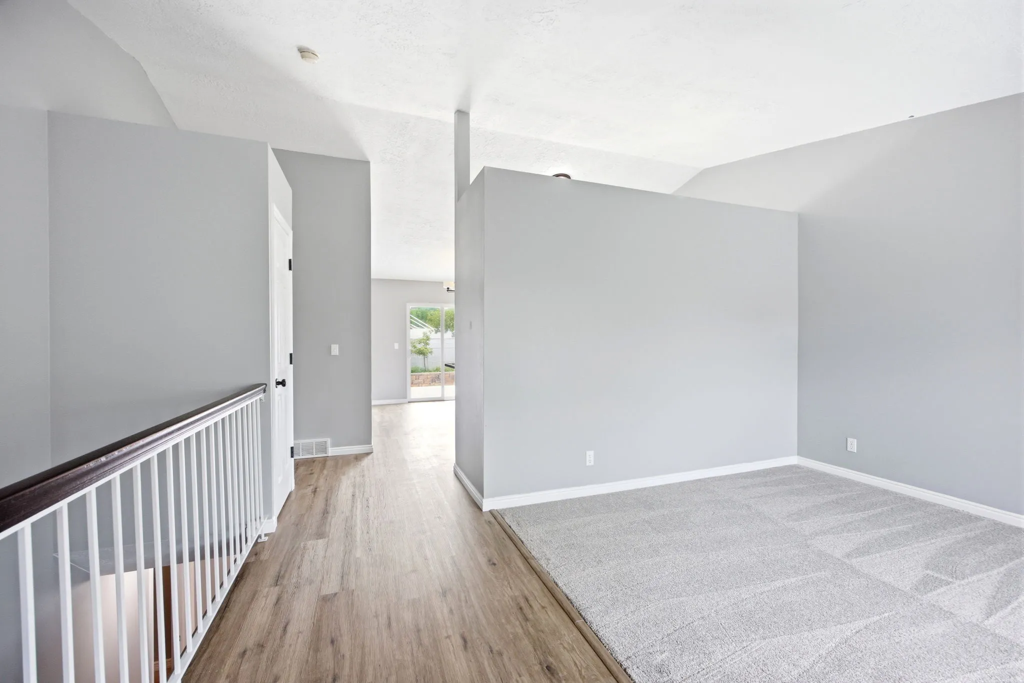 Vaulted ceilings with light gray walls