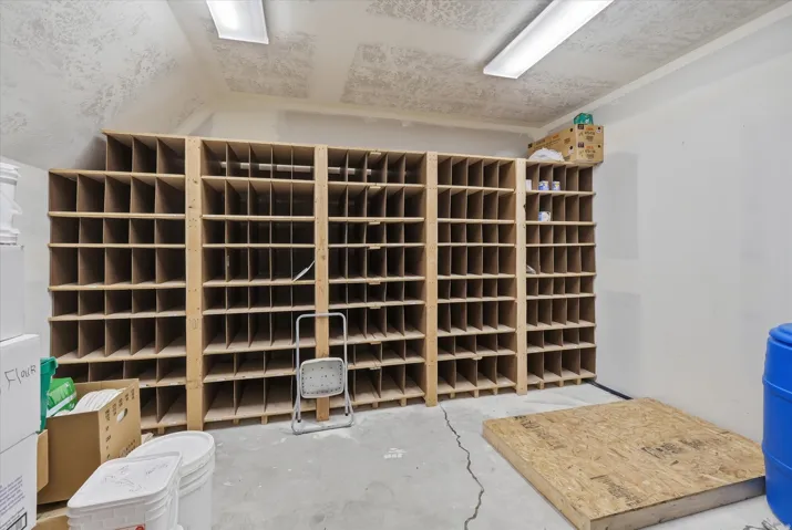 Extensive built-in wood shelving units provide substantial storage capacity