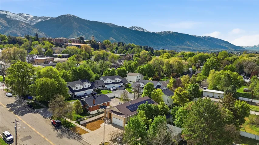 Aerial perspective featuring a residential area with a prominent mountain backdrop
