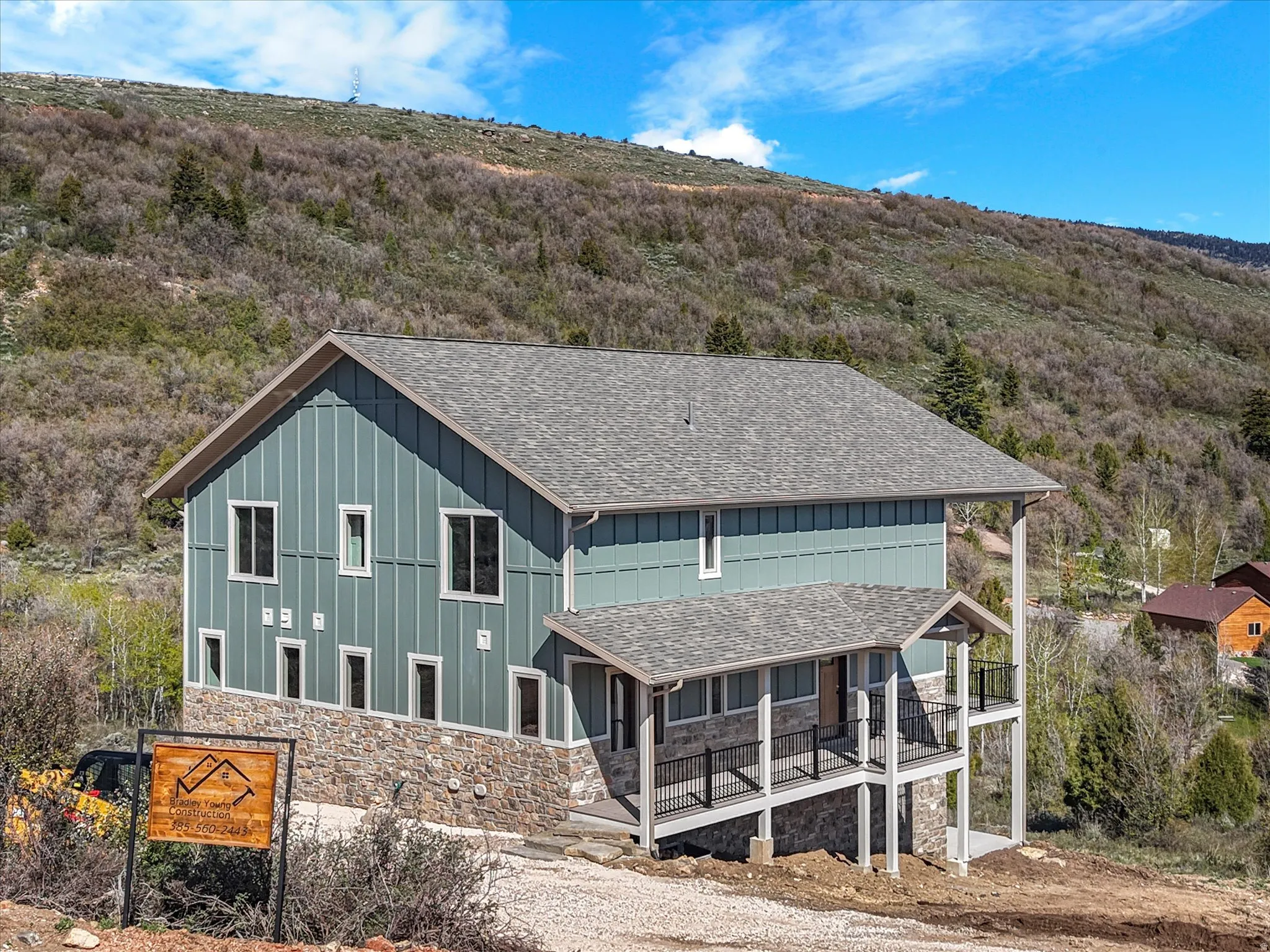 Contemporary mountain-style residence featuring a board and batten facade