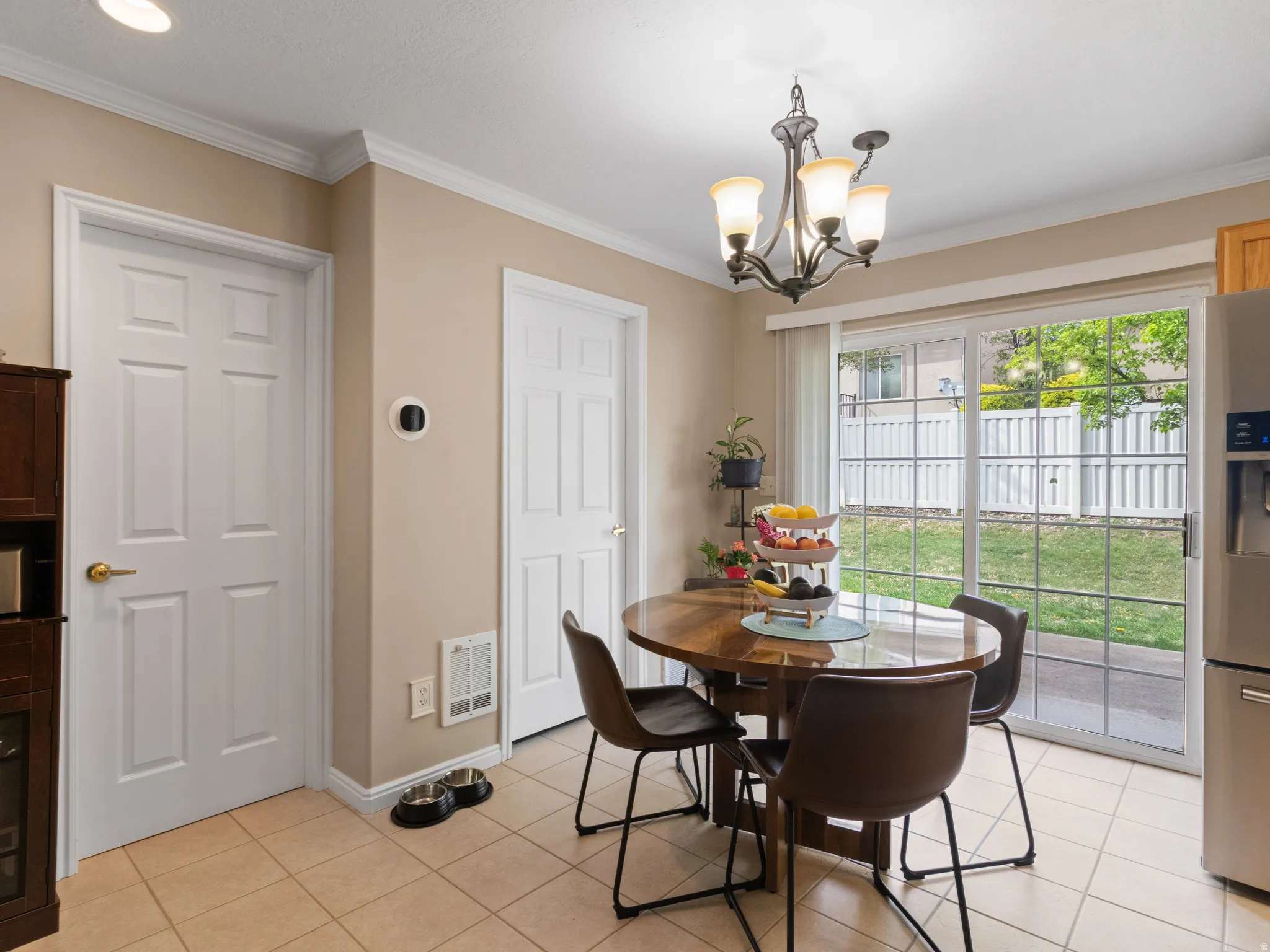 Sliding glass doors provide direct access to the backyard