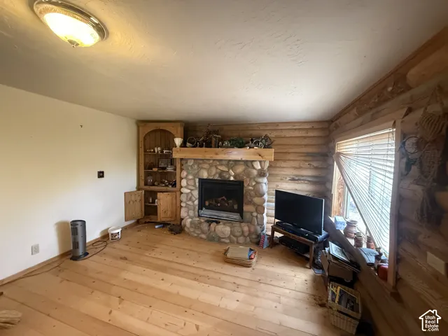 Stone-faced fireplace with a wood mantel