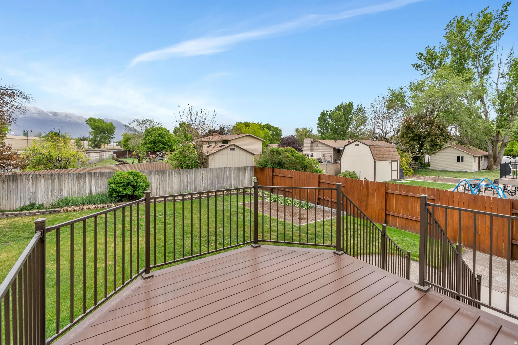 Expansive outdoor deck featuring composite decking and metal railings