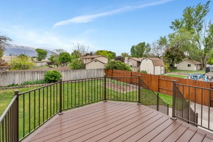 Expansive outdoor deck featuring composite decking and metal railings