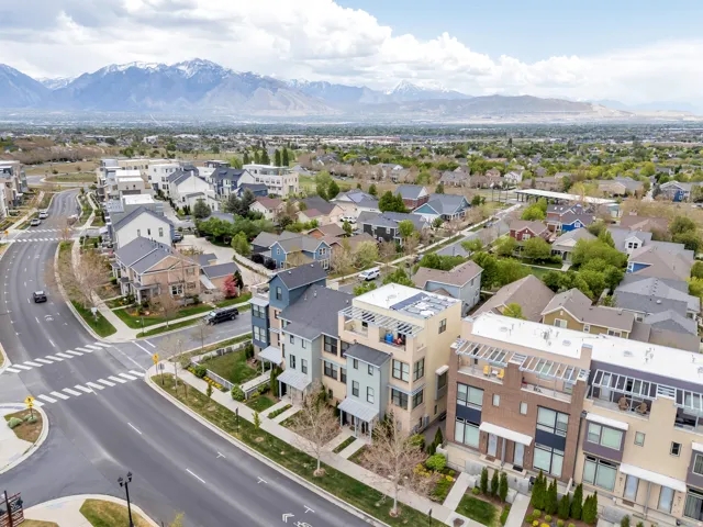 Townhome community featuring multi-level residences with modern architectural designs and contrasting exterior finishes