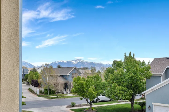 Snow-capped mountain range providing a scenic backdrop to the residential setting