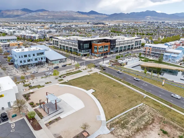 Urban development featuring multi-story commercial buildings with modern glass facades