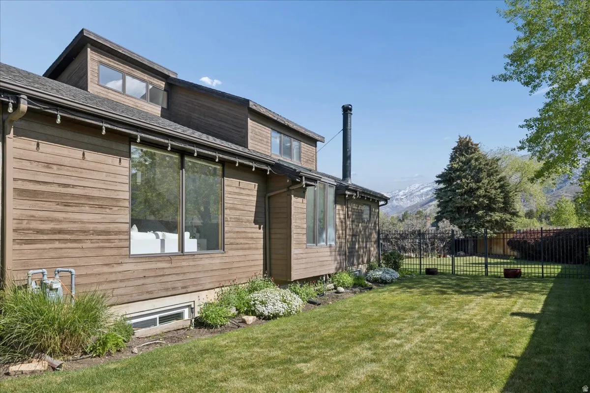 Brown-toned horizontal siding with multiple large windows