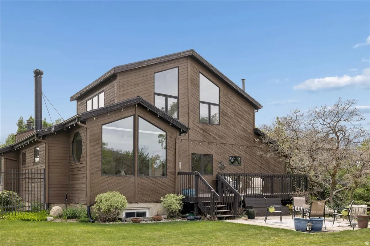 Exterior featuring brown wood siding and a multi-level deck