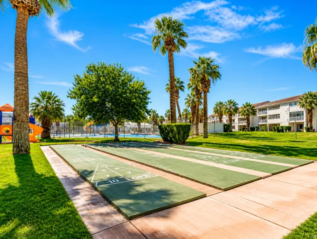 Shuffleboard courts featuring a concrete perimeter and green playing surfaces