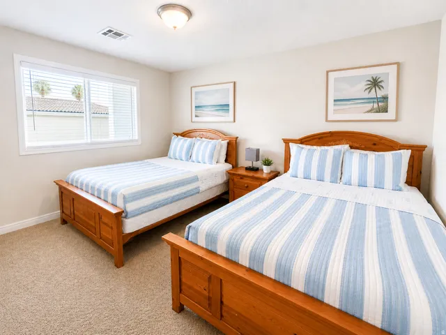 Two wood-finish bed frames feature matching headboards and footboards