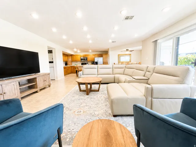Open-concept living area with recessed lighting and tile flooring