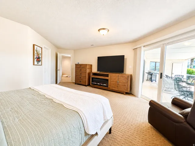 Spacious room featuring broadloom carpeting and light-toned walls