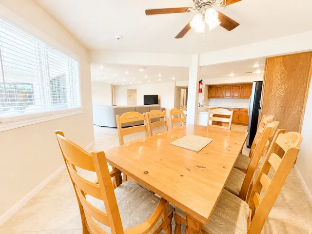 Dining area with tile flooring and a ceiling fan