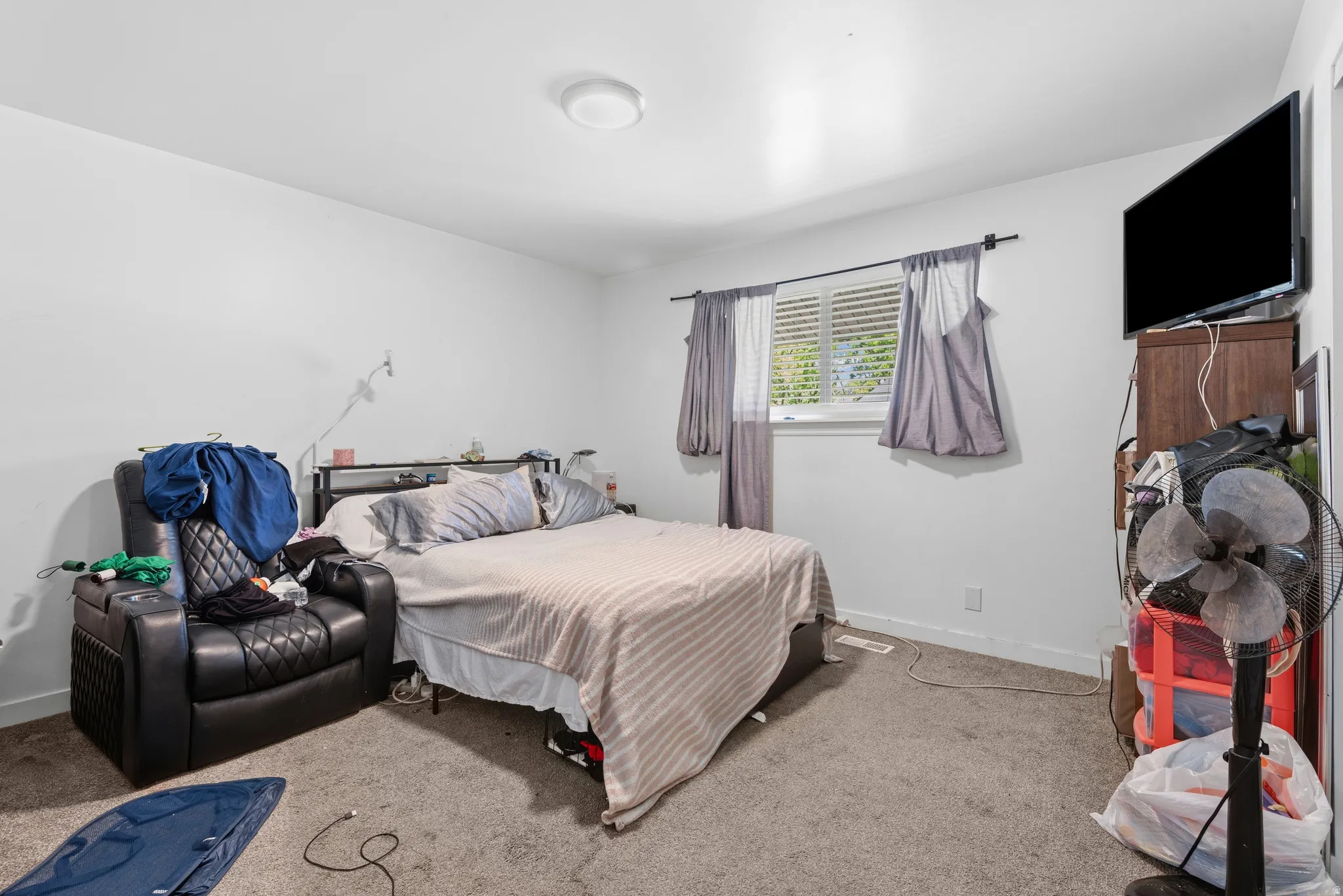 Bedroom featuring light gray carpet flooring and white painted walls
