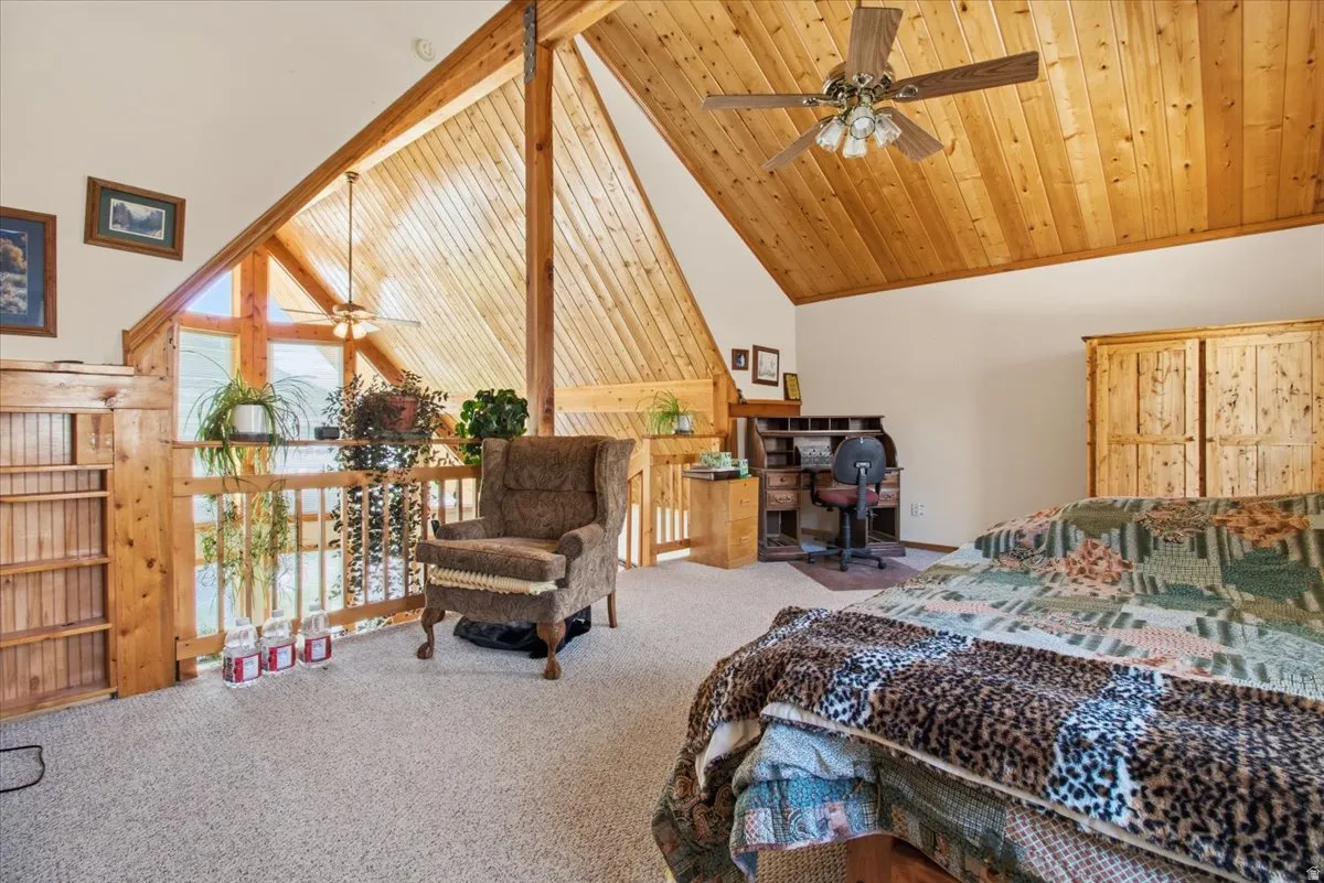Vaulted wood-paneled ceiling with exposed beams
